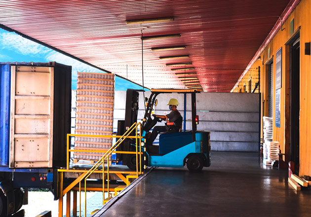 Forklift unloaded a truck from a loading dock